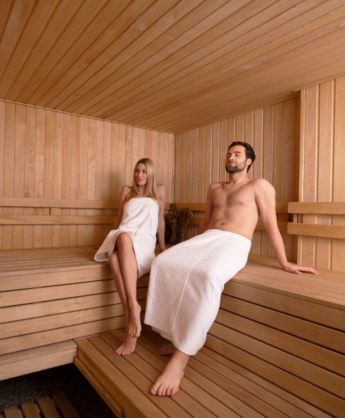 Couple enjoying the sauna of the resort