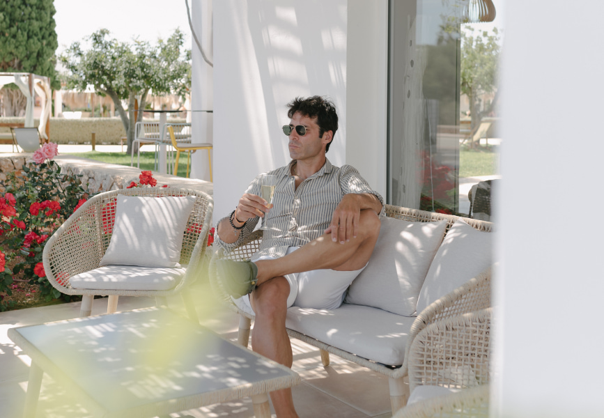 Hotel guest enjoying a glass of cava at the Pool Bar