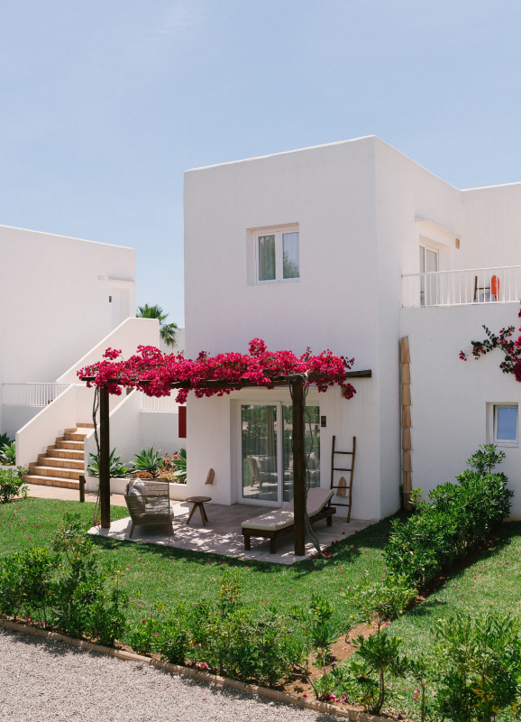 Nice terrace of one of the rooms decorated with Buganvilias