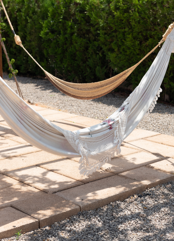 Hammocks hanging in the pool area