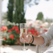 Customer holding a glass of cava