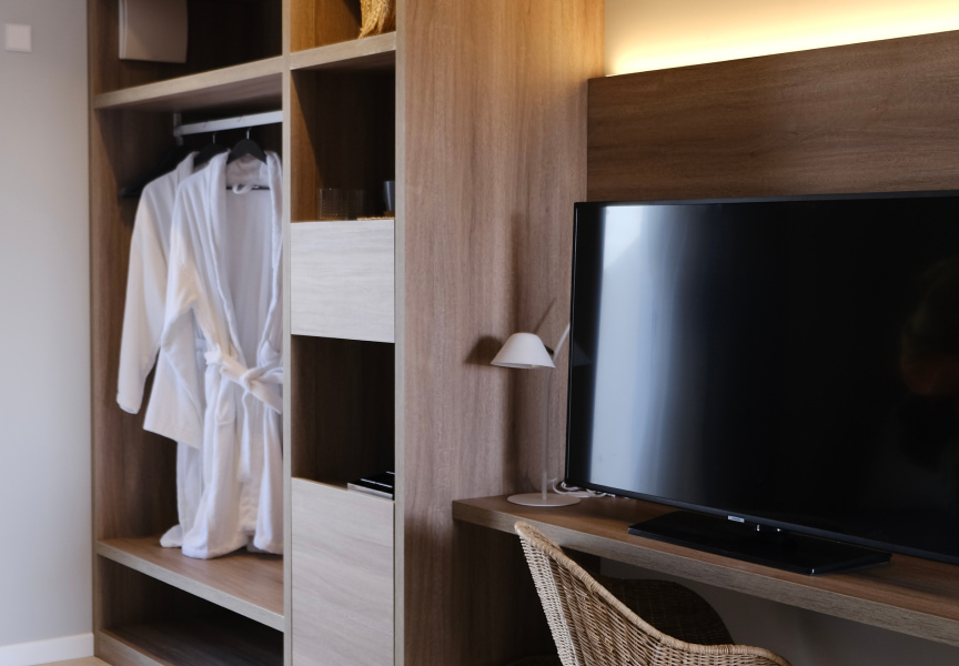 Wardrobe without doors and flat screen TV