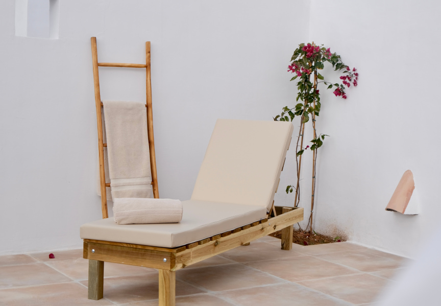 Outdoor hammock with wooden ladder at the back for towels